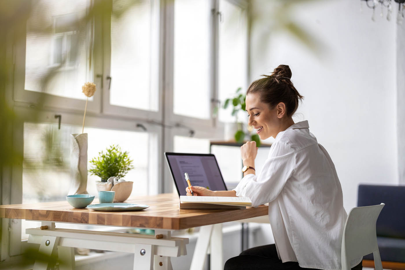 A woman looking at information about Hello Pest Control, one of the top pest control companies.