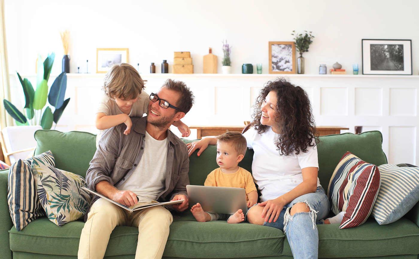 A family sitting on their couch - Hello Pest Control offers rodent control solutions to protect you and everyone on your property.