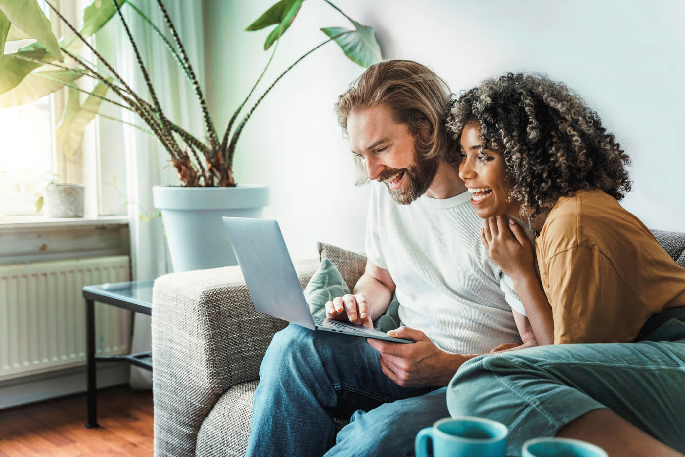 A couple checking out Hello Pest Control's pest plans for their home.