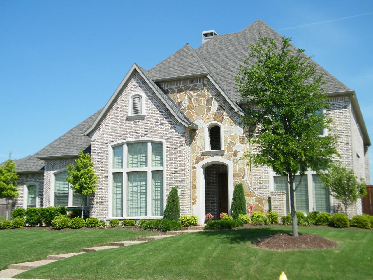 a brick house in a suburban area